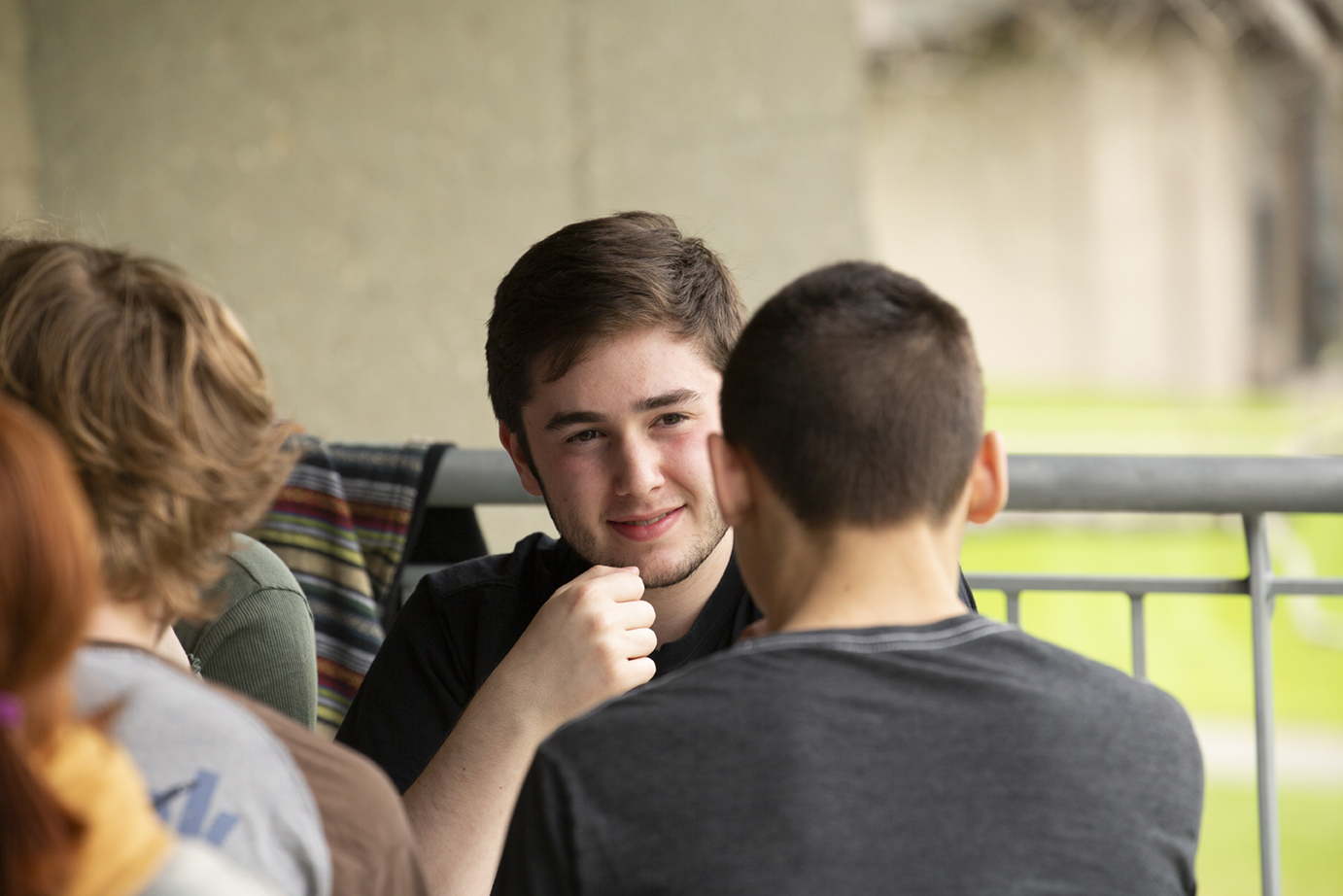 Students eating on dining hall balcony